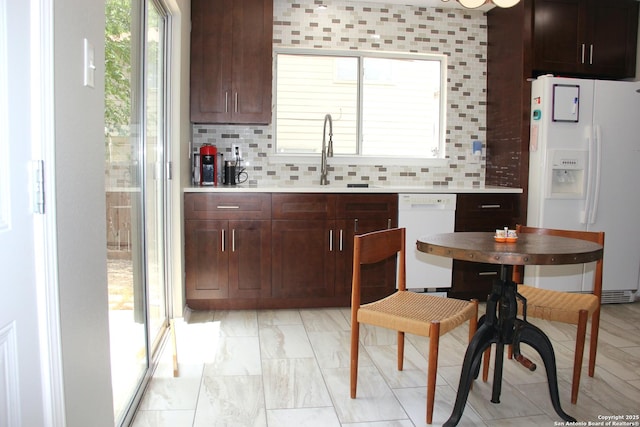 39 Latrobe Post, San Antonio, TX 78240 - kitchen with white appliances, a sink, light countertops, and decorative backsplash