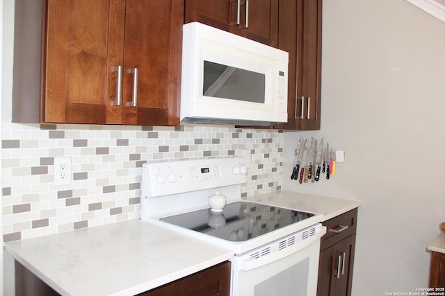 39 Latrobe Post, San Antonio, TX 78240 - kitchen with white appliances, backsplash, and light countertops