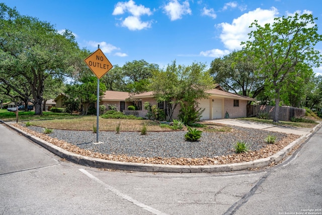 402 Waycrest, Windcrest, TX 78239 - view of front of property featuring a garage, driveway, and brick siding