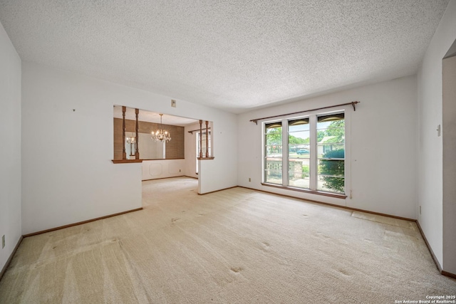 402 Waycrest, Windcrest, TX 78239 - carpeted spare room featuring a chandelier, a textured ceiling, and baseboards