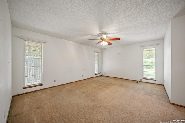 402 Waycrest, Windcrest, TX 78239 - empty room with plenty of natural light, carpet floors, ceiling fan, and a textured ceiling