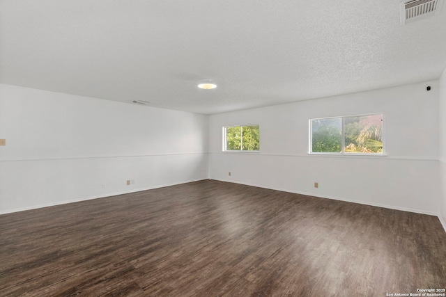 8131 Talkenhorn, Converse, TX 78109 - empty room with dark wood-style flooring and baseboards