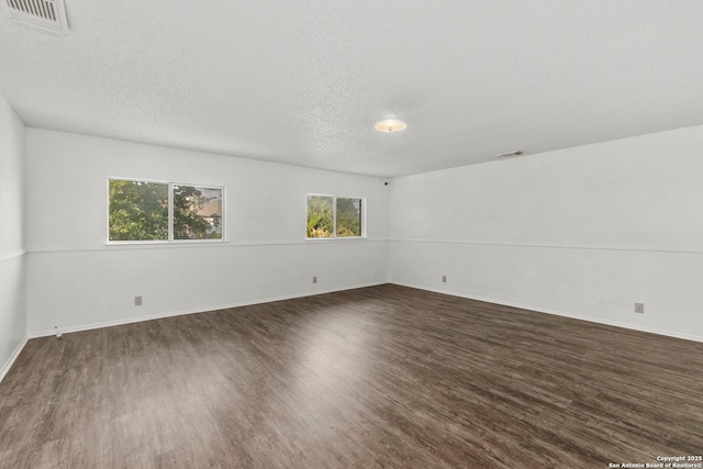 8131 Talkenhorn, Converse, TX 78109 - empty room with wood finished floors, a textured ceiling, and baseboards