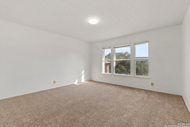 8131 Talkenhorn, Converse, TX 78109 - unfurnished room with light carpet, a textured ceiling, and baseboards