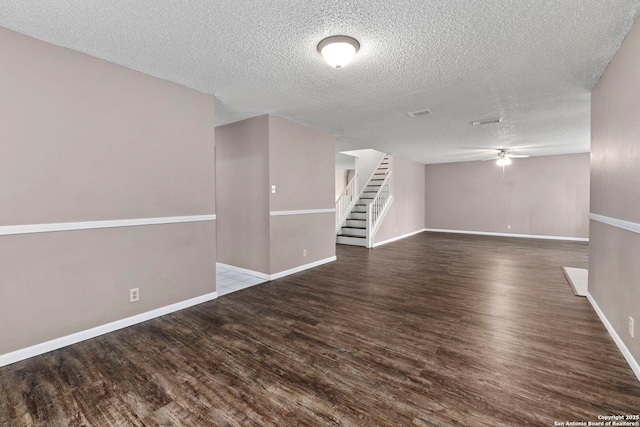 8131 Talkenhorn, Converse, TX 78109 - spare room featuring wood finished floors, stairs, a textured ceiling, a ceiling fan, and baseboards