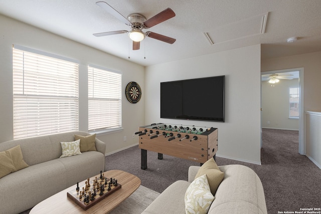 135 Agency Oaks, San Antonio, TX 78249 - carpeted living area featuring a ceiling fan, healthy amount of natural light, and baseboards