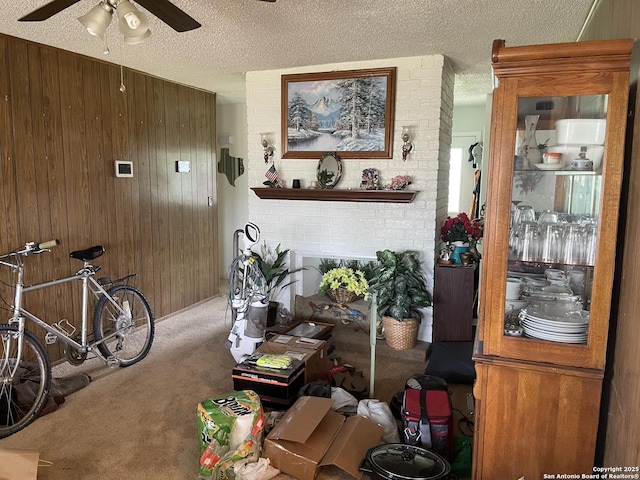 6823 S Whitland, San Antonio, TX 78239 - carpeted living area featuring wooden walls, ceiling fan, and a textured ceiling