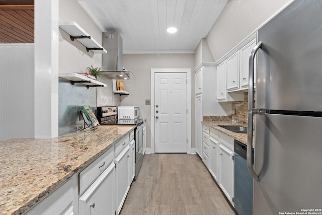 1170 Garraty Rd Unit 14, San Antonio, TX 78209 - kitchen featuring appliances with stainless steel finishes, open shelves, white cabinets, light wood-type flooring, and light stone countertops