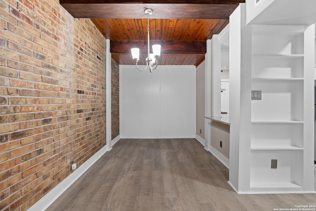 1170 Garraty Rd Unit 14, San Antonio, TX 78209 - corridor featuring brick wall, wood ceiling with exposed beams, a chandelier, built in shelves, and wood finished floors