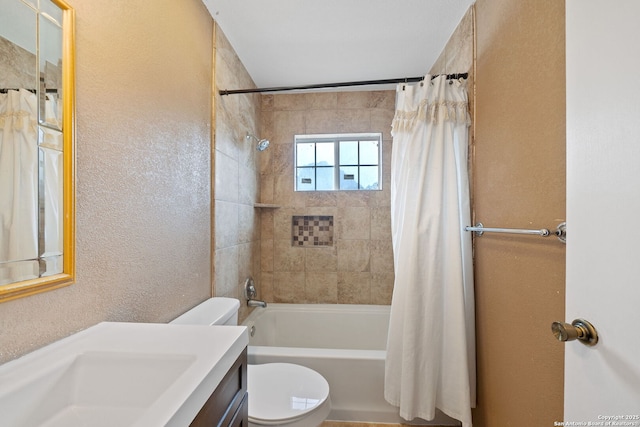 9419 Powhatan Unit 504, San Antonio, TX 78230 - bathroom featuring toilet, vanity, shower / tub combo with curtain, and a textured wall