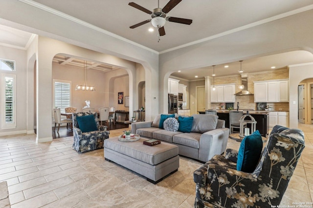 24227 Vecchio, San Antonio, TX 78260 - living area featuring arched walkways, healthy amount of natural light, a ceiling fan, ornamental molding, and baseboards