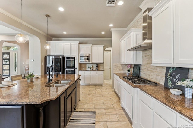 24227 Vecchio, San Antonio, TX 78260 - kitchen with a sink, appliances with stainless steel finishes, wall chimney exhaust hood, arched walkways, and crown molding