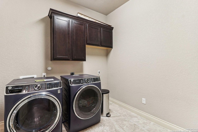 24227 Vecchio, San Antonio, TX 78260 - laundry area with washing machine and dryer, cabinet space, and baseboards