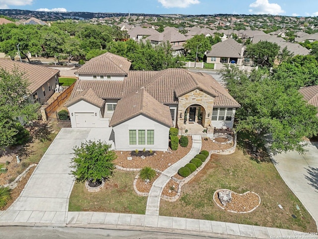 24227 Vecchio, San Antonio, TX 78260 - view of front facade with driveway, stone siding, a tiled roof, and a residential view
