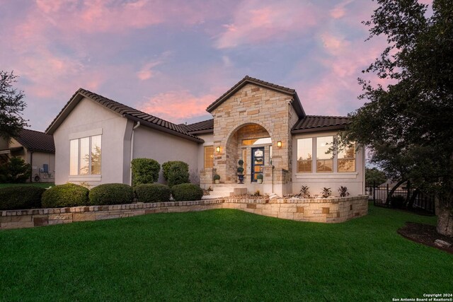 24227 Vecchio, San Antonio, TX 78260 - view of front of home with a front lawn, stone siding, a tile roof, and stucco siding