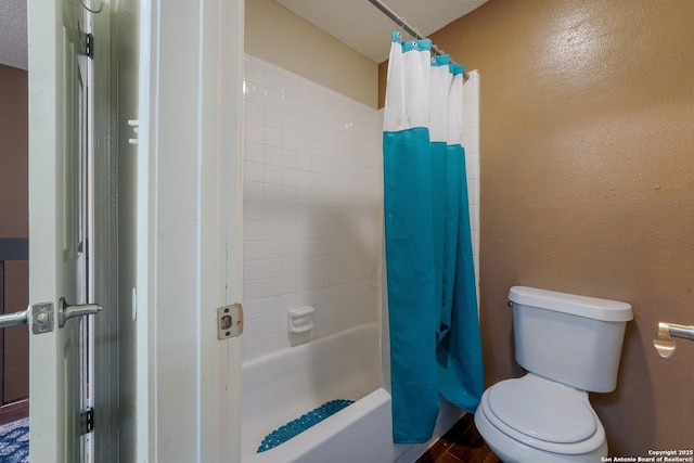 4107 Medical Dr Unit 2204, San Antonio, TX 78229 - full bath with toilet, shower / bath combo, a textured wall, and wood finished floors