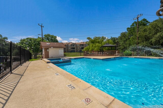 4107 Medical Dr Unit 2204, San Antonio, TX 78229 - view of swimming pool with a gazebo, a pool with connected hot tub, and a patio area