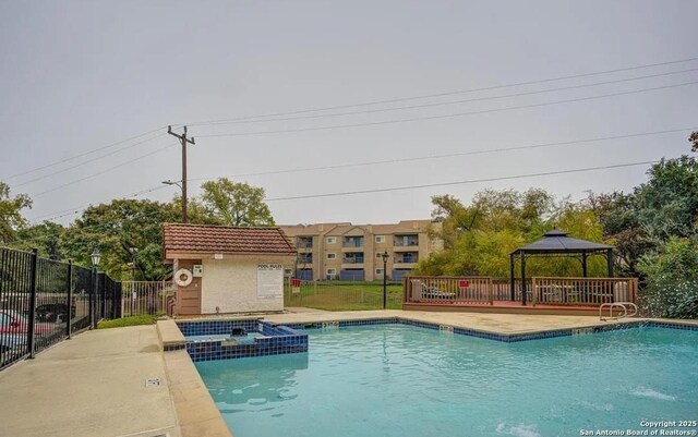 4107 Medical Dr Unit 2204, San Antonio, TX 78229 - view of swimming pool with a pool with connected hot tub and a gazebo