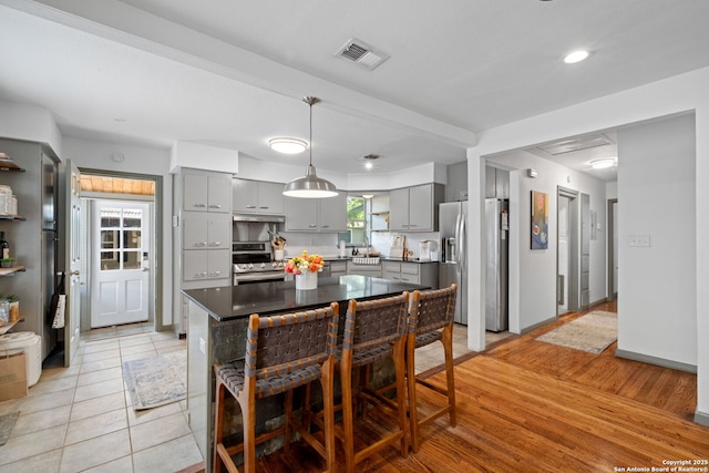 221 Calumet, San Antonio, TX 78209 - kitchen with gray cabinetry, stainless steel appliances, dark countertops, pendant lighting, and recessed lighting