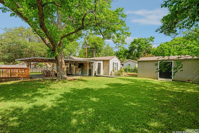 221 Calumet, San Antonio, TX 78209 - view of green lawn with an outbuilding
