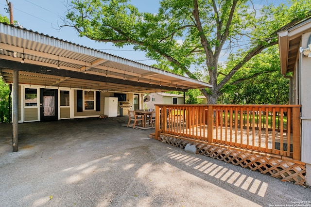 221 Calumet, San Antonio, TX 78209 - view of patio / terrace with a carport, outdoor dining area, and a deck