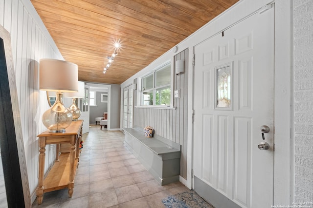 221 Calumet, San Antonio, TX 78209 - foyer with wood ceiling, baseboards, and light tile patterned flooring