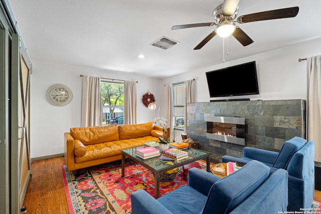 221 Calumet, San Antonio, TX 78209 - living room with wood finished floors, a glass covered fireplace, a ceiling fan, recessed lighting, and baseboards