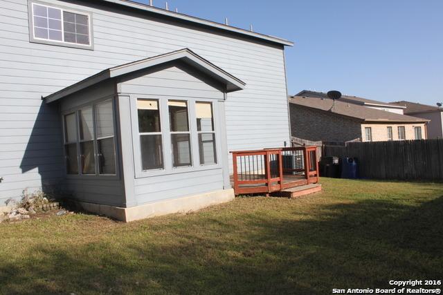 10047 Powderhouse Dr, San Antonio, TX 78239 - rear view of property with a wooden deck