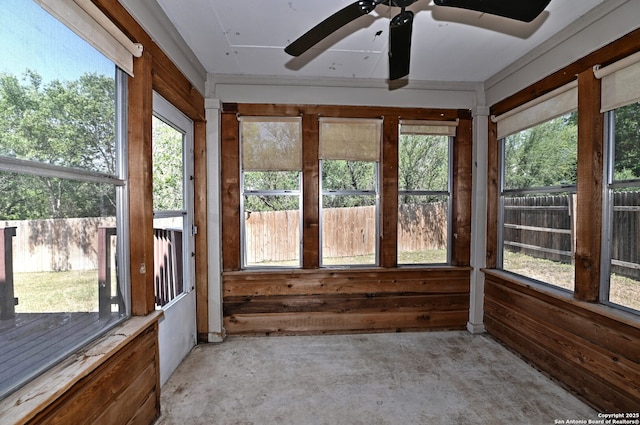 10047 Powderhouse Dr, San Antonio, TX 78239 - unfurnished sunroom with concrete floors and wood walls