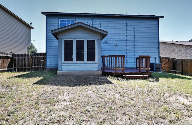 10047 Powderhouse Dr, San Antonio, TX 78239 - back of property featuring a deck and central AC unit