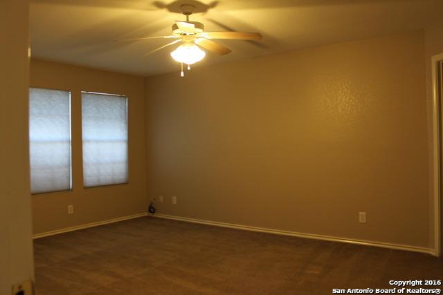 10047 Powderhouse Dr, San Antonio, TX 78239 - empty room featuring a ceiling fan and baseboards