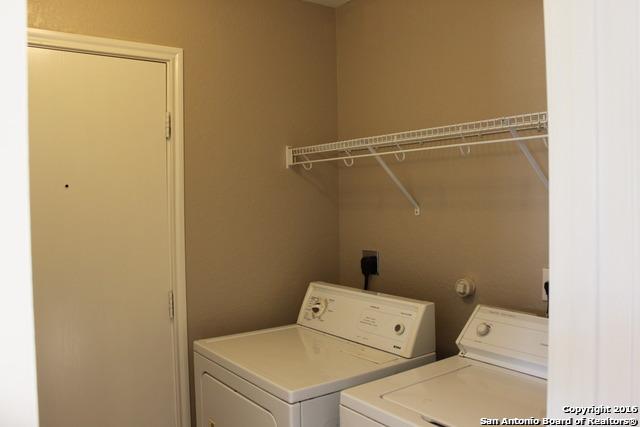 10047 Powderhouse Dr, San Antonio, TX 78239 - laundry area with washer and dryer