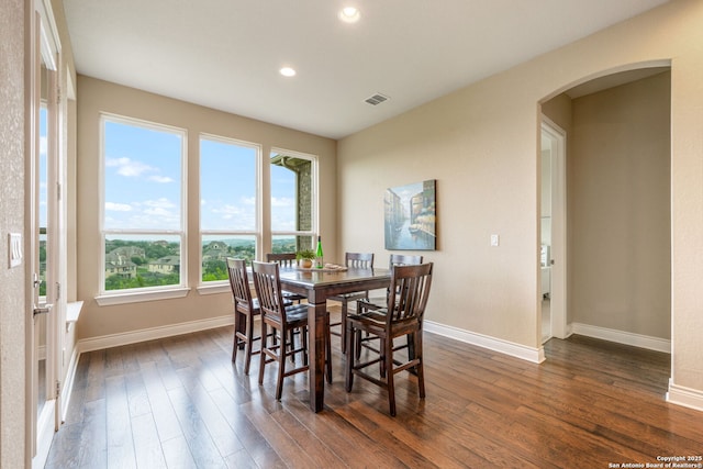 3122 Running Fawn, San Antonio, TX 78261 - dining space with arched walkways, baseboards, dark wood-style floors, and recessed lighting