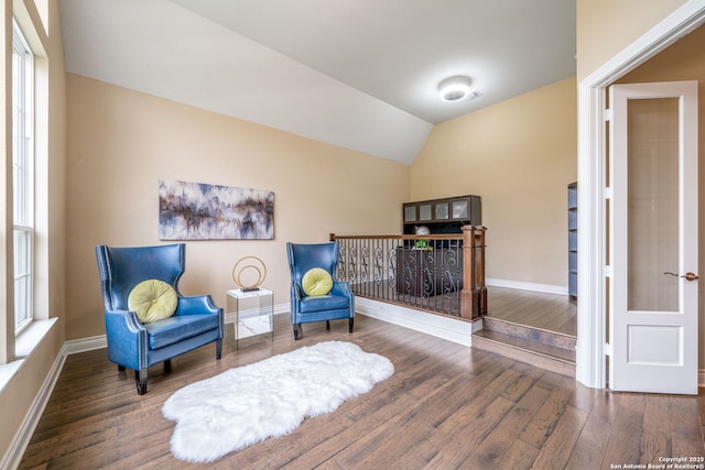 3122 Running Fawn, San Antonio, TX 78261 - living area with wood finished floors, baseboards, and vaulted ceiling