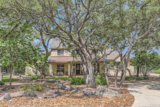 12424 Andice, Helotes, TX 78023 - obstructed view of property with a standing seam roof, metal roof, stucco siding, and covered porch