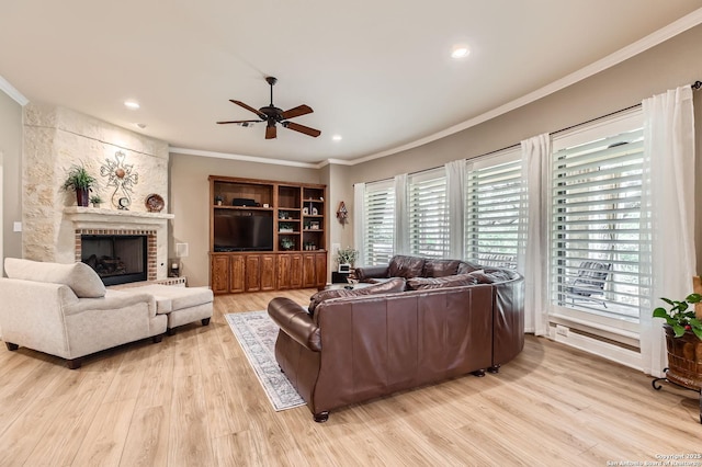 12424 Andice, Helotes, TX 78023 - living room with plenty of natural light, crown molding, a ceiling fan, light wood-style flooring, and recessed lighting