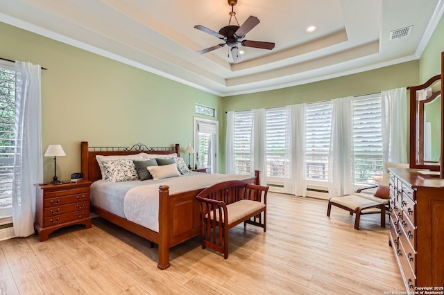 12424 Andice, Helotes, TX 78023 - bedroom featuring a tray ceiling, light wood-style flooring, ornamental molding, recessed lighting, and ceiling fan