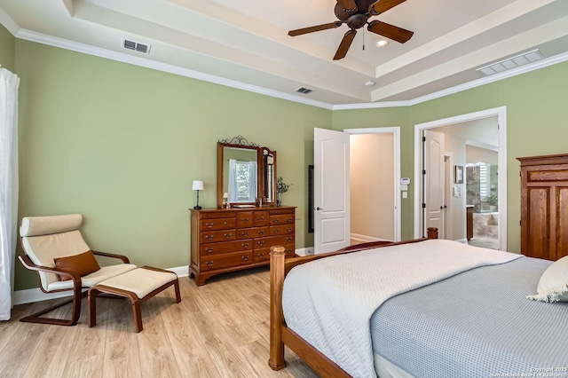 12424 Andice, Helotes, TX 78023 - bedroom featuring a tray ceiling, multiple windows, light wood-style flooring, crown molding, and recessed lighting
