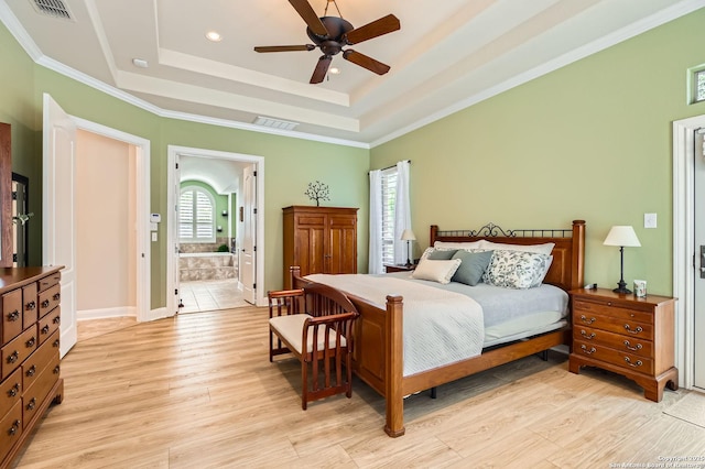 12424 Andice, Helotes, TX 78023 - bedroom with light wood-type flooring, a tray ceiling, crown molding, recessed lighting, and ensuite bath