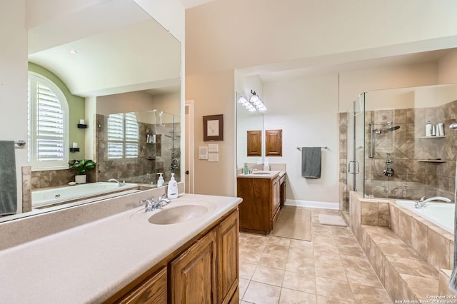 12424 Andice, Helotes, TX 78023 - bathroom featuring two vanities, a bath, a shower stall, and tile patterned flooring