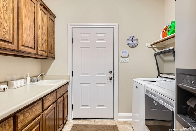 12424 Andice, Helotes, TX 78023 - laundry room with washer and clothes dryer, cabinet space, and baseboards