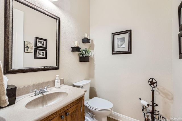 12424 Andice, Helotes, TX 78023 - half bath with toilet, vanity, and baseboards