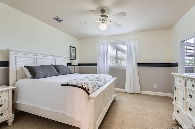 12424 Andice, Helotes, TX 78023 - bedroom with light carpet, ceiling fan, and baseboards