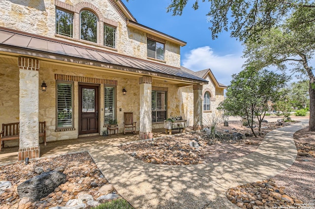 12424 Andice, Helotes, TX 78023 - entrance to property with a standing seam roof, a porch, and stone siding