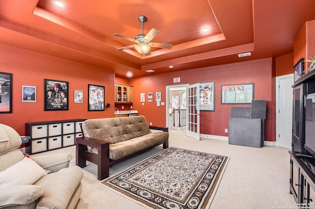 12424 Andice, Helotes, TX 78023 - carpeted living room featuring a tray ceiling, ceiling fan, recessed lighting, baseboards, and french doors