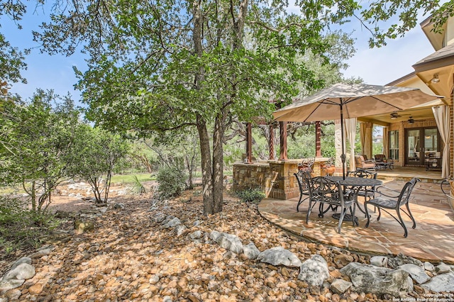 12424 Andice, Helotes, TX 78023 - view of yard with ceiling fan, a patio area, and outdoor dining area