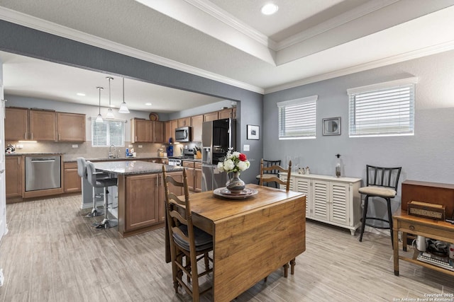 3402 Red Fls, San Antonio, TX 78253 - dining space featuring healthy amount of natural light, light wood-style floors, a tray ceiling, recessed lighting, and ornamental molding
