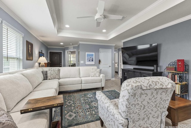 3402 Red Fls, San Antonio, TX 78253 - living room featuring plenty of natural light, wood finished floors, ceiling fan, a tray ceiling, and recessed lighting