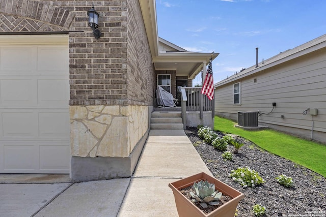 3402 Red Fls, San Antonio, TX 78253 - entrance to property featuring central air condition unit, a porch, and brick siding