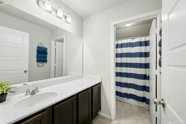 9210 Yaya Rd, Converse, TX 78109 - bathroom featuring vanity, tile patterned floors, and a shower with shower curtain